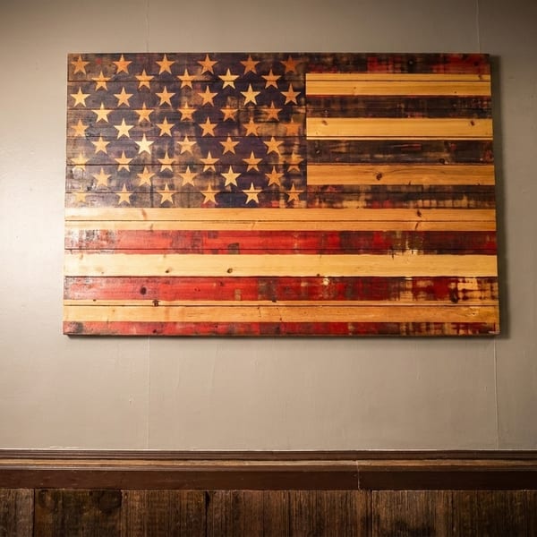 Rustic wooden American flag art hangs on a gray wall above dark wood paneling.